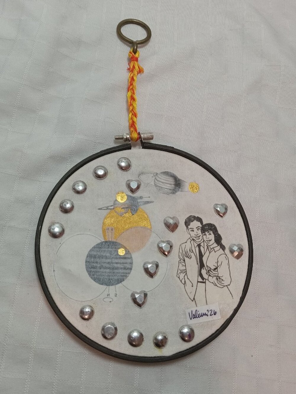 Handmade prints of old magazines on cotton & mixed media in a cross-stitch hoop